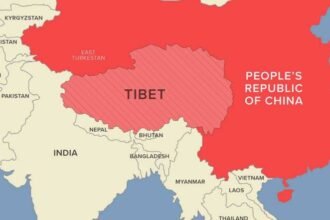 Map showing Tibet separately from the People's Republic of China, with surrounding countries including India, Bhutan, Nepal, and Myanmar. Tibet is shaded with red stripes, emphasizing its distinct identity from mainland China. India shares a border with Tibet